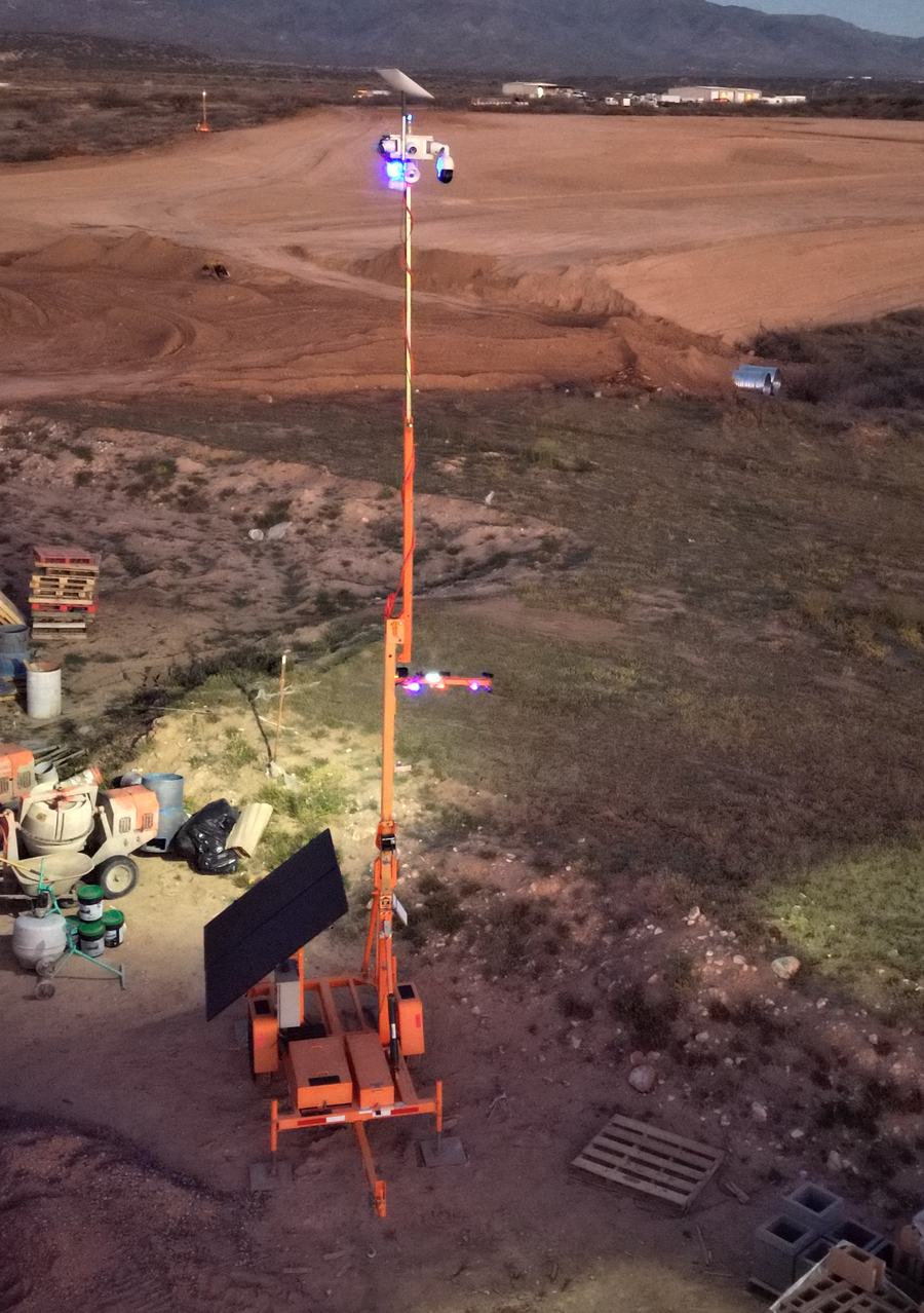 Close view of a Guardian Rover 360 trailer on site with mast raised and solar array deployed.
